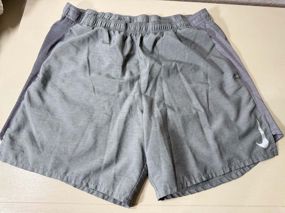 Nike Gray Men’s size small* running shorts with Pockets